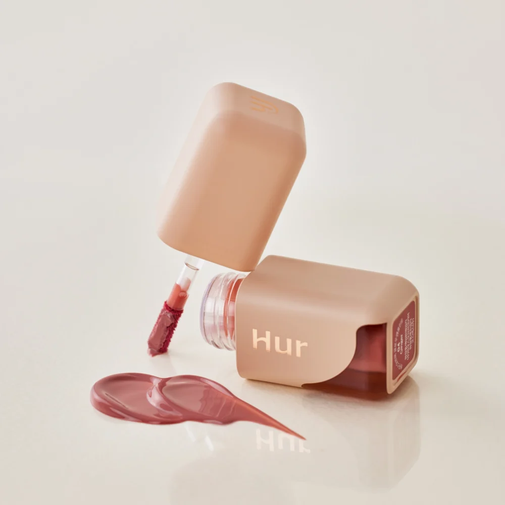 HOUSE OF HUR Glow Ampoule Tint drėkinantis, ilgai išliekantis lūpų blizgesys (spalva Ginger)